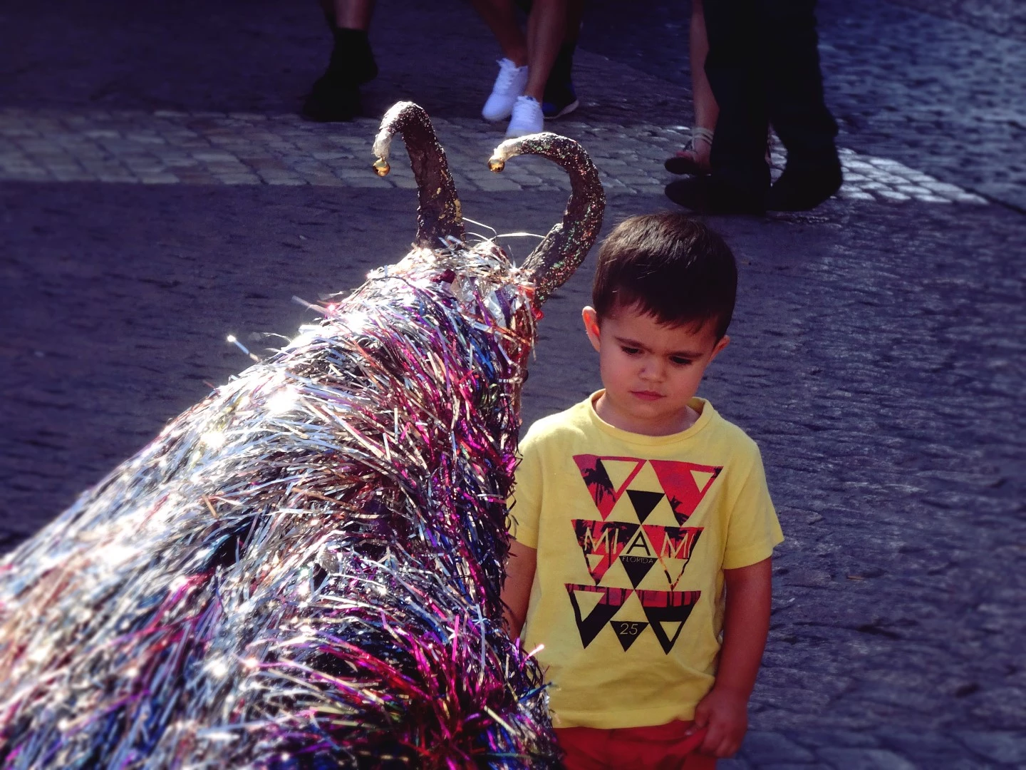 photography of a kid in front of a fantasygoat in madrid