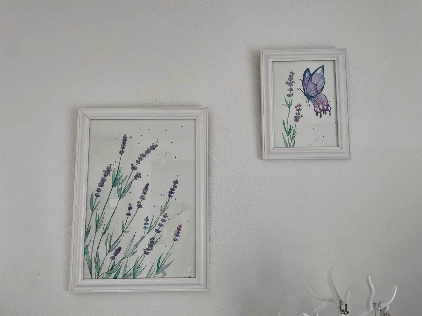 watercolor painting lavender and butterfly framed on a wall